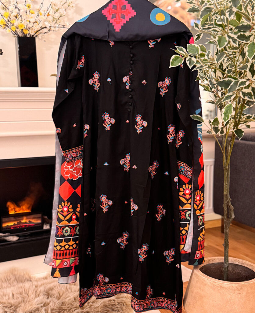 Elegant Mushq floral embroidered anarkali in organza, a highlight in pakistani suits online for festive seasons.